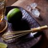 Bamboo whisk and hammered for mixing cocktails on hammered bronze tray|small Bamboo whisk for cocktails