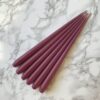 Pack of 6 hand dipped taper candles in Raspberry colour - Curious Egg|raspberry taper candles in gold candleholder