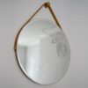 Daniel Heath Swooping Jay Engraved Circular Mirror with waxed ply frame haning on a wall. Curious Egg.|Daniel Heath Swooping Jay Engraved Circular Mirror - closeup of engraving detail. Curious Egg.|Daniel Heath Swooping Jay Engraved Circular Mirror with waxed ply frame - closeup of frame detail. Curious Egg.|Daniel Heath Swooping Jay and Heronry engraved circular mirrors displayed on wall with wooden chest of drawers and green vase in the foreground. Curious Egg.|Daniel Heath Swooping Jay Engraved Circular Mirror with black satin frame hanging on a wall.. Curious Egg.|Daniel Heath Swooping Jay Engraved Circular Mirror with black satin frame - closeup of frame detail. Curious Egg.|
