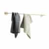 Gold towel rail with dishcloths hanging from it|gold towel rail cut out image|gold towel rail with clothes hanging from it|gold towel rail cut out image